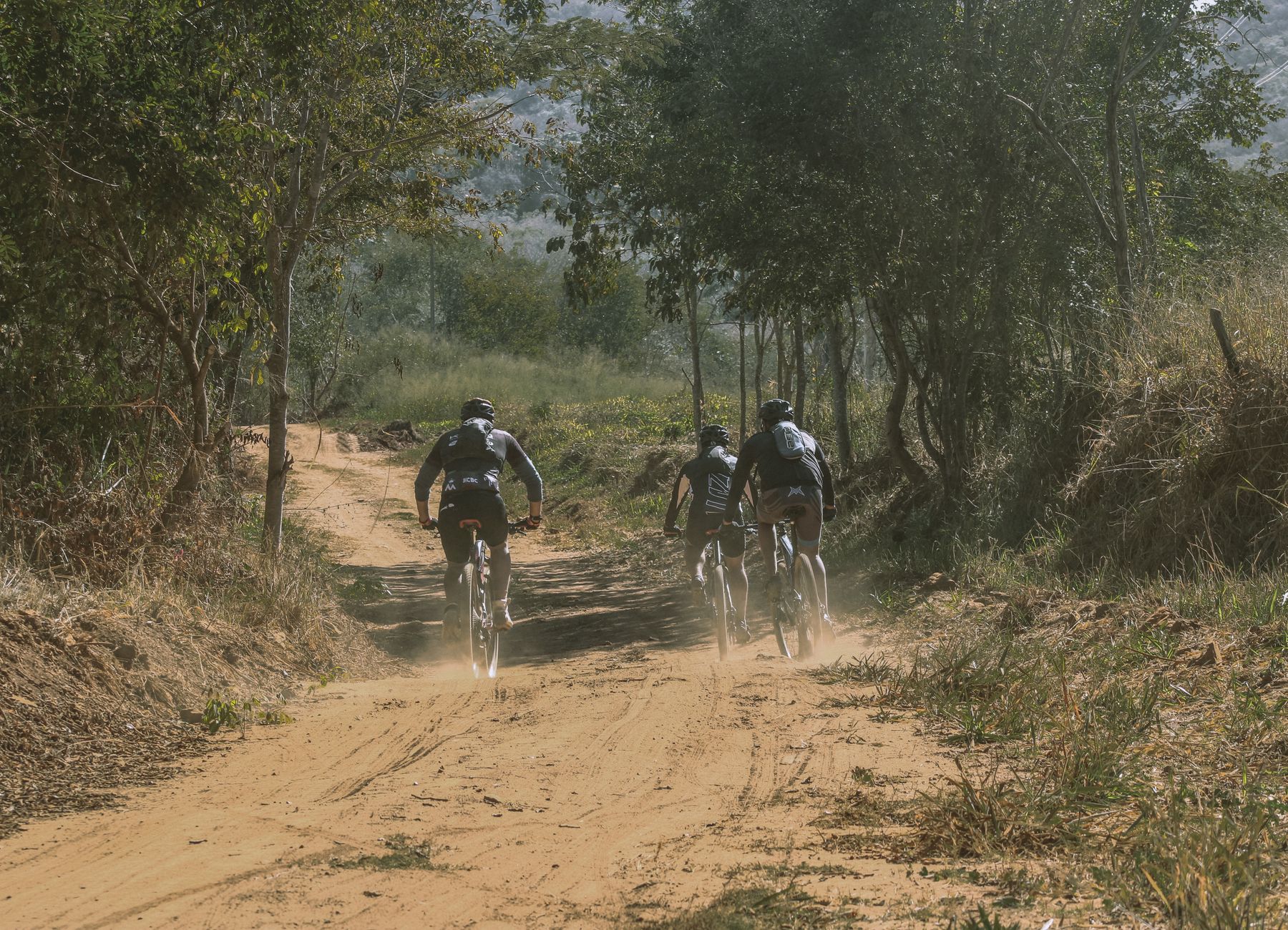 women mountain biking group ride singletrack